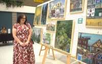 Artist looking at their artwork