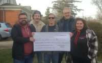 Members of the Fort Erie Radio team hand over a cheque for $7,540 to Mike Daigle as part of the COPE Christmas Cash Split. From left: Brent Jones, Jack Sutherland, Daigle, Steve Simkus, and Brenda Tyrrell