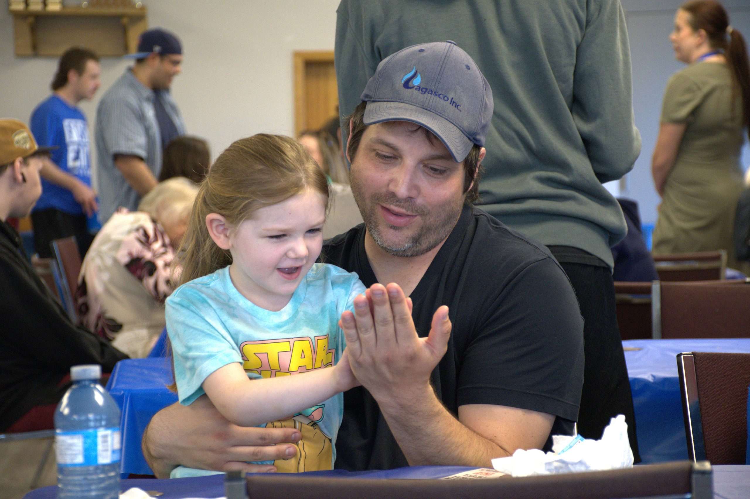 A father and daughter having some fun at the Fort Erie Radio community barbecue