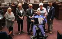 Photo of para hockey player Alan Dickson with members of Fort Erie council